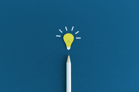 Illustration of a vertical pencil point on a blue background, with a yellow light bulb above it