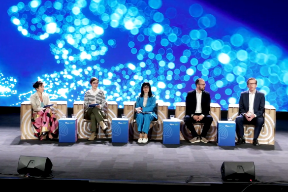 Five panel members sitting in a row on armchairs