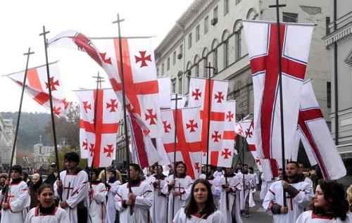 In Georgia, Christmas is also celebrated on the 7th of January. On Christmas day, many people attend Alilo, a parade in the streets. They are dressed in special costumes to celebrate Christmas and often carry Georgian flags. Some also dress as characters from the Christmas story. Children are often given sweets. 