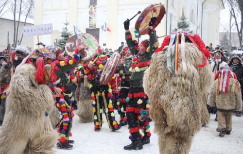 In Romania, the christmas tree is decorated on the eve December 24th.  On this day, children go carol singing and get sweets, fruits, traditional cakes and sometimes money. Adults too go carol singing on Christmas Day. In many parts of the country, someone dresses up as a goat with a colourful mask and goes around the carol singers. This person jumps and dances around and causes lots of mischief.  Another tradition is a drumming band. It is made up of un-married men and often includes other instruments as well. The bands start practicing a month before Christmas and go around the city, collecting gifts. 